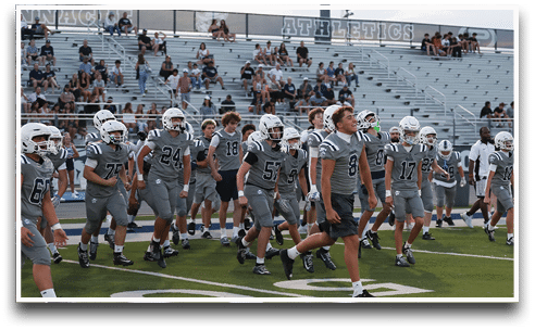 Three football players are standing on the field, one of them is smiling and wearing a black jersey with the number 55. AI generated content