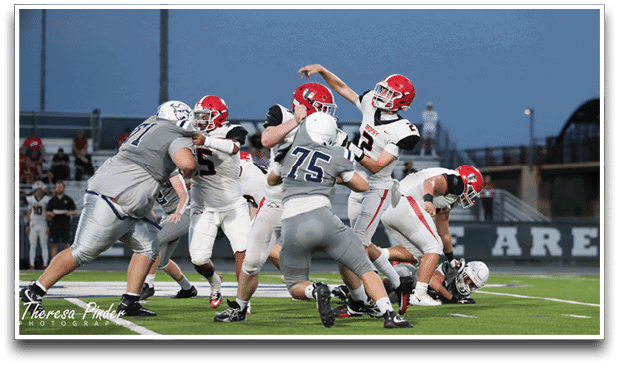 Three football players are standing on the field, one of them is smiling and wearing a black jersey with the number 55. AI generated content