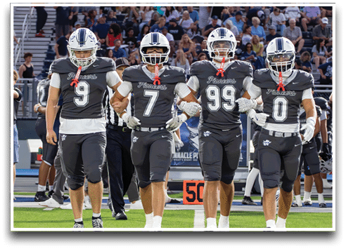Three football players are standing on the field, one of them is smiling and wearing a black jersey with the number 55. AI generated content