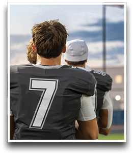 Three football players are standing on the field, one of them is smiling and wearing a black jersey with the number 55. AI generated content