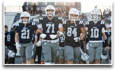 Three football players are standing on the field, one of them is smiling and wearing a black jersey with the number 55. AI generated content
