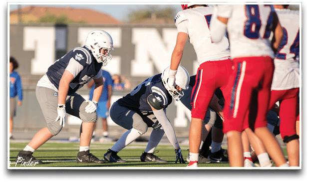 Three football players are standing on the field, one of them is smiling and wearing a black jersey with the number 55. AI generated content
