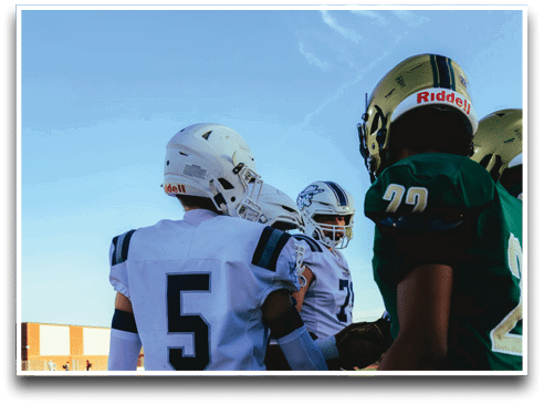 Three football players are standing on the field, one of them is smiling and wearing a black jersey with the number 55. AI generated content