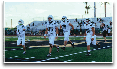 Three football players are standing on the field, one of them is smiling and wearing a black jersey with the number 55. AI generated content