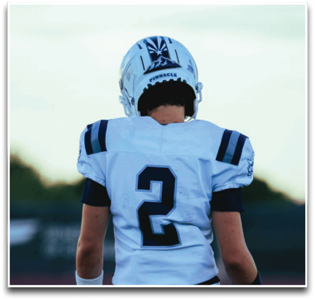 Three football players are standing on the field, one of them is smiling and wearing a black jersey with the number 55. AI generated content