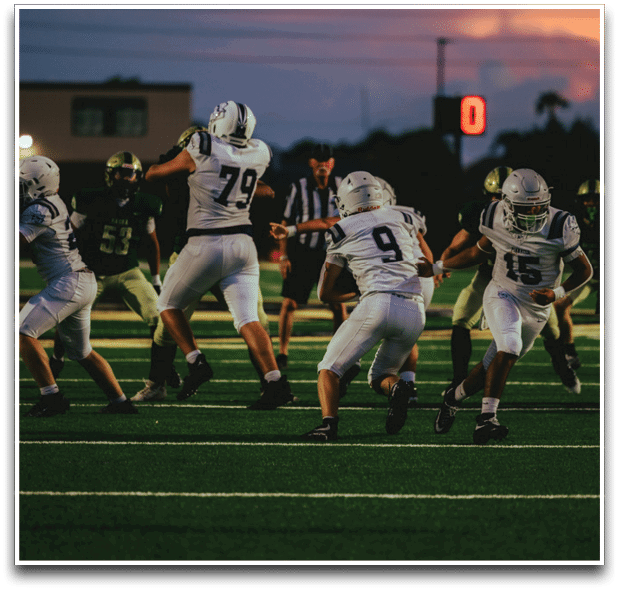 Three football players are standing on the field, one of them is smiling and wearing a black jersey with the number 55. AI generated content