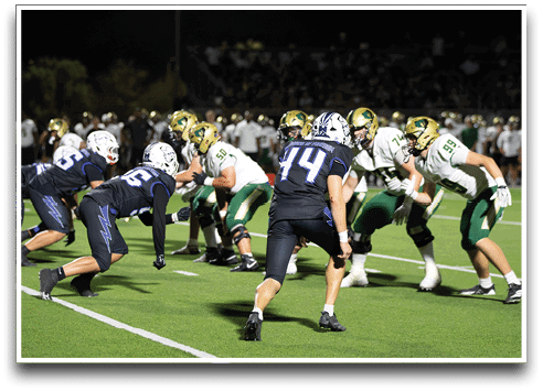 Three football players are standing on the field, one of them is smiling and wearing a black jersey with the number 55. AI generated content