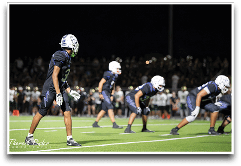 Three football players are standing on the field, one of them is smiling and wearing a black jersey with the number 55. AI generated content