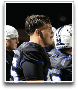 Three football players are standing on the field, one of them is smiling and wearing a black jersey with the number 55. AI generated content