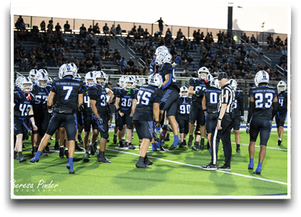 Three football players are standing on the field, one of them is smiling and wearing a black jersey with the number 55. AI generated content