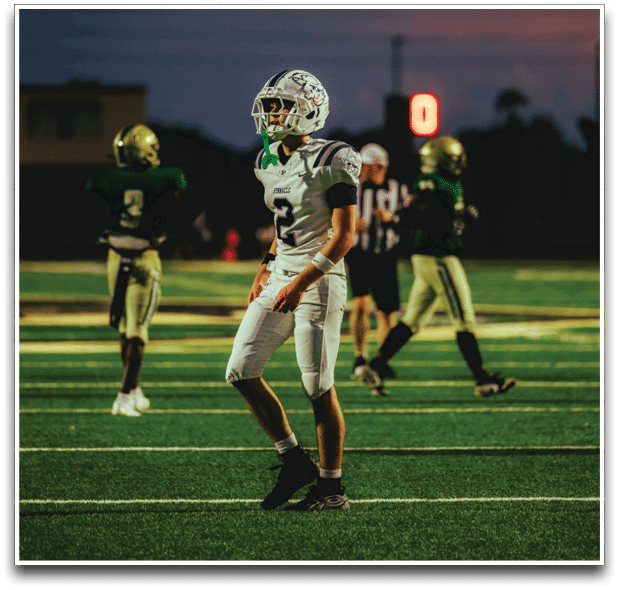Three football players are standing on the field, one of them is smiling and wearing a black jersey with the number 55. AI generated content