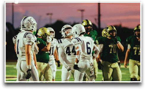Three football players are standing on the field, one of them is smiling and wearing a black jersey with the number 55. AI generated content