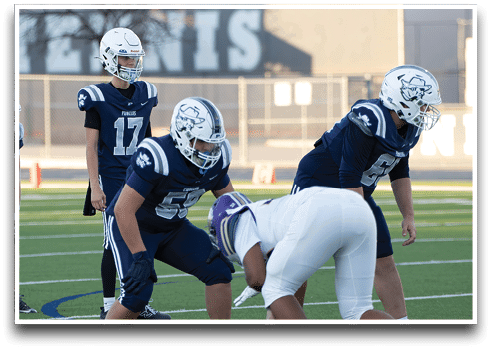 Three football players are standing on the field, one of them is smiling and wearing a black jersey with the number 55. AI generated content