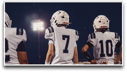 Three football players are standing on the field, one of them is smiling and wearing a black jersey with the number 55. AI generated content