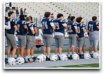 Three football players are standing on the field, one of them is smiling and wearing a black jersey with the number 55. AI generated content