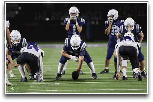 Three football players are standing on the field, one of them is smiling and wearing a black jersey with the number 55. AI generated content