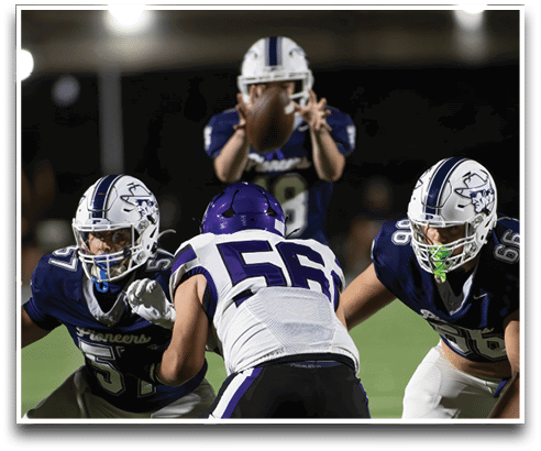 Three football players are standing on the field, one of them is smiling and wearing a black jersey with the number 55. AI generated content