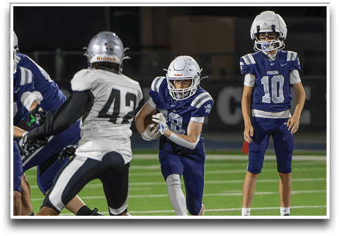 Three football players are standing on the field, one of them is smiling and wearing a black jersey with the number 55. AI generated content