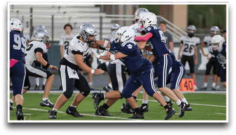Three football players are standing on the field, one of them is smiling and wearing a black jersey with the number 55. AI generated content