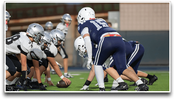 Three football players are standing on the field, one of them is smiling and wearing a black jersey with the number 55. AI generated content