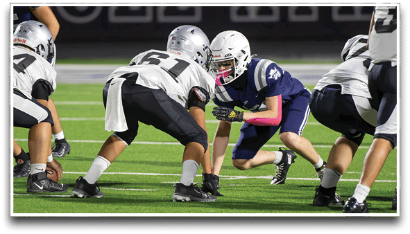 Three football players are standing on the field, one of them is smiling and wearing a black jersey with the number 55. AI generated content