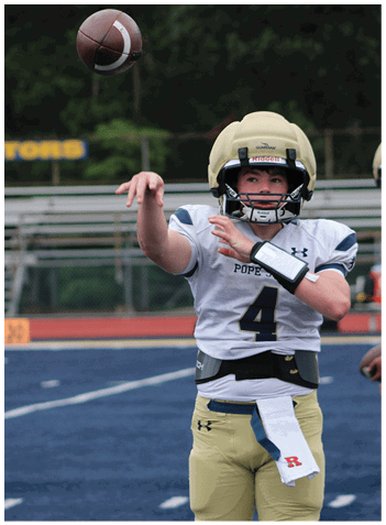 A football player wearing a blue jersey with the number 58 on it. Description generated by AI