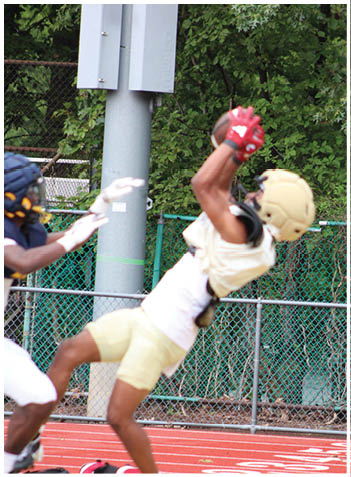A football player wearing a blue jersey with the number 58 on it. Description generated by AI