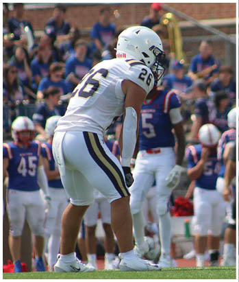 A group of football players celebrating a touchdown. Description generated by AI
