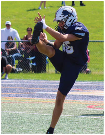 A group of football players celebrating a touchdown. Description generated by AI