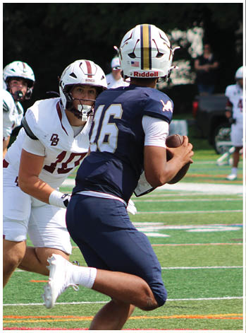 A group of football players celebrating a touchdown. Description generated by AI