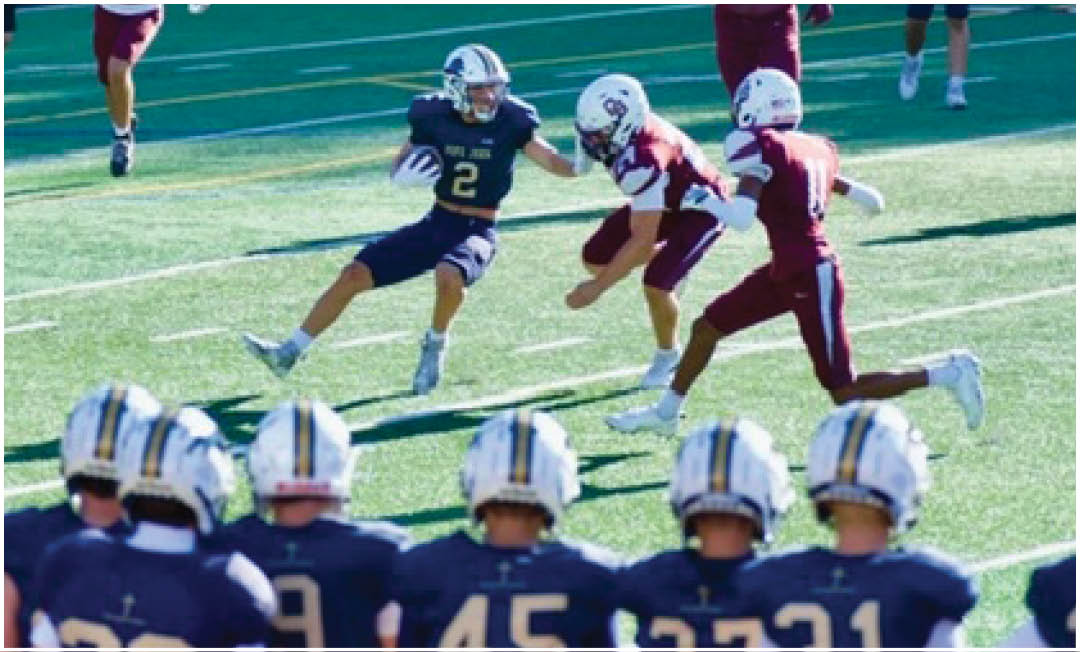 A football player wearing a blue and white uniform. Description generated by AI