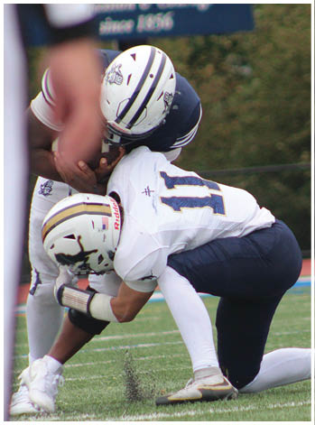 A group of football players celebrating a touchdown. Description generated by AI
