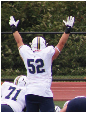 A group of football players celebrating a touchdown. Description generated by AI