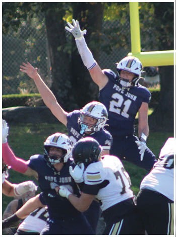 A group of football players celebrating a touchdown. Description generated by AI