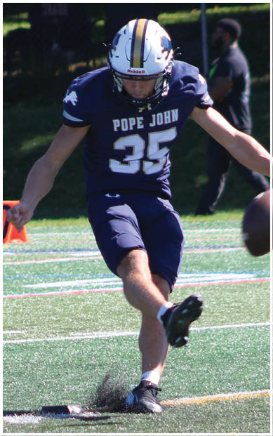 A football player wearing a blue and red jersey. Description generated by AI