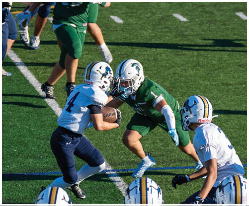 A football player wearing a blue and white uniform. Description generated by AI