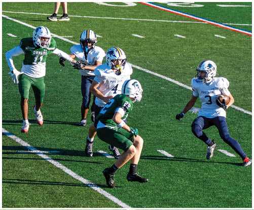 A football player wearing a blue and white uniform. Description generated by AI