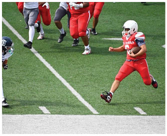 A group of football players on a field. Description generated by AI