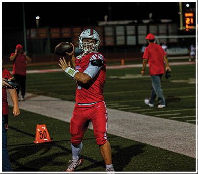 A football player running on the field. Description generated by AI