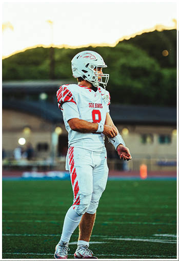 A group of football players celebrating a touchdown. Description generated by AI