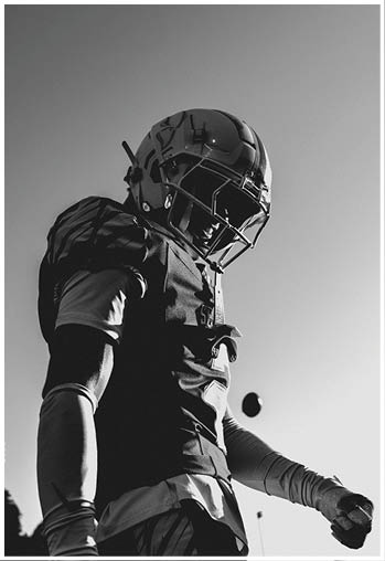 A group of football players celebrating a touchdown. Description generated by AI