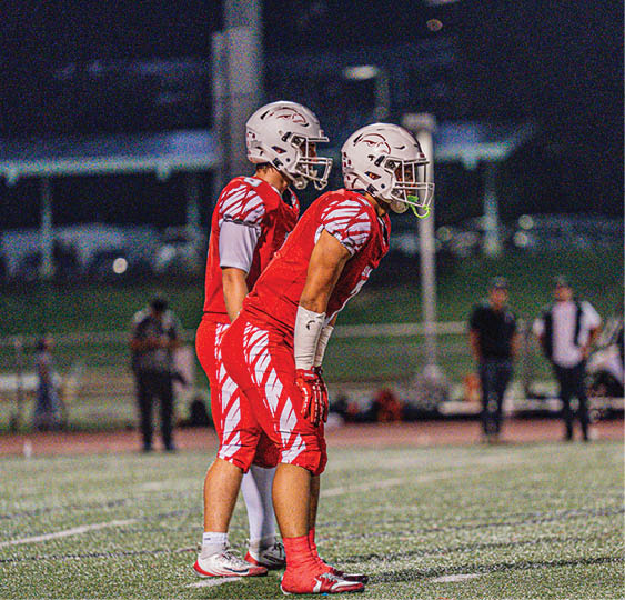 A group of football players celebrating a victory. AI generated content