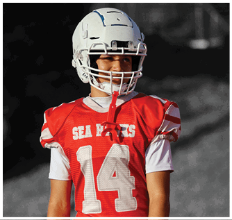 A group of football players on a field. Description generated by AI