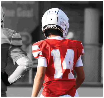 A group of football players on a field. Description generated by AI