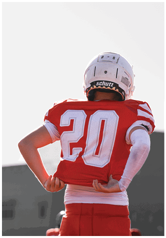 A football player catching a ball. Description generated by AI
