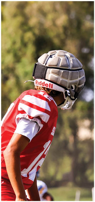 A football game is being played on a field. Description generated by AI