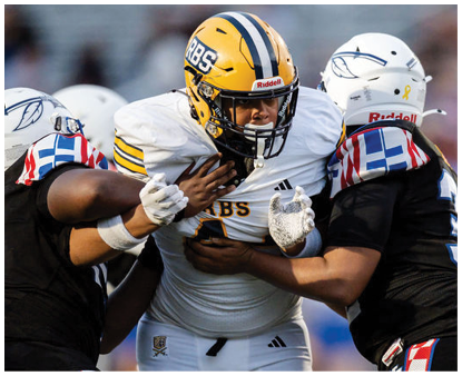 Three people in football uniforms are engaged in a play with one person in a white jersey and yellow helmet being tackled by two others in black jerseys and white helmets. Description generated by AI