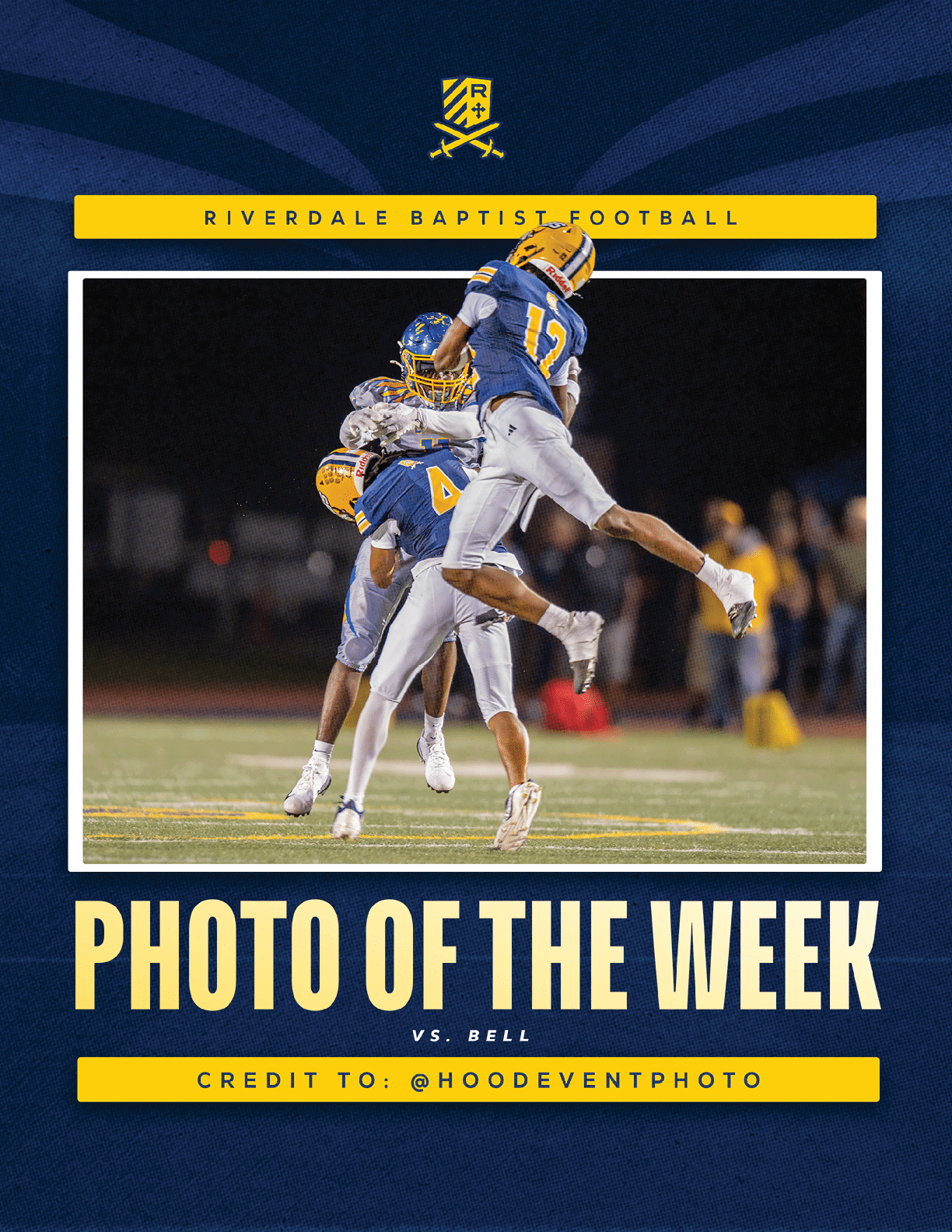 Two football players in blue and yellow uniforms celebrate on a field at night while a player in a gray uniform is caught between them. Description generated by AI