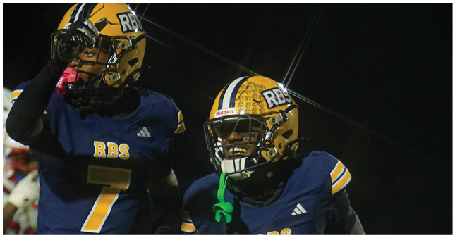 Two people in football uniforms with helmets and numbers seven and one are celebrating on a field at night. Description generated by AI