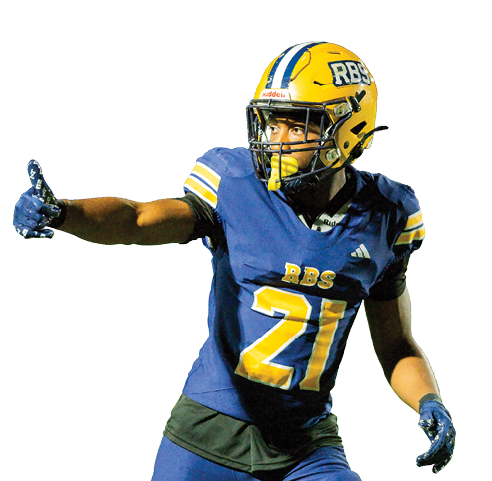 A person wearing a blue and yellow football uniform with the number 21 is pointing with their left hand while standing on a field. Description generated by AI